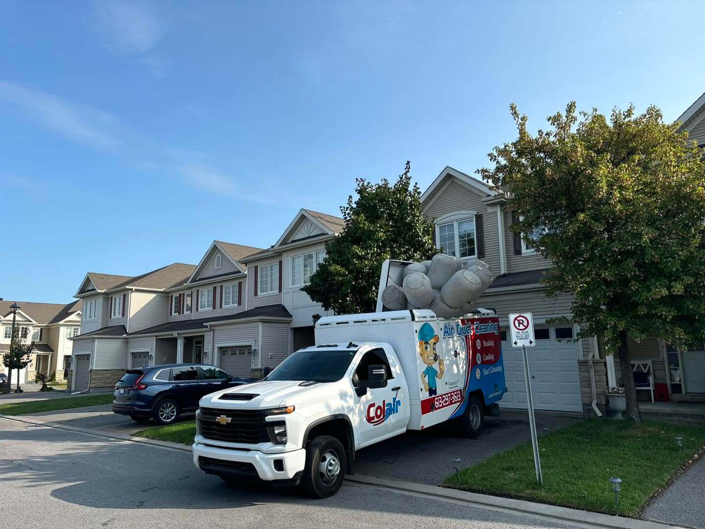 Duct cleaning team standing beside their truck in Ottawa